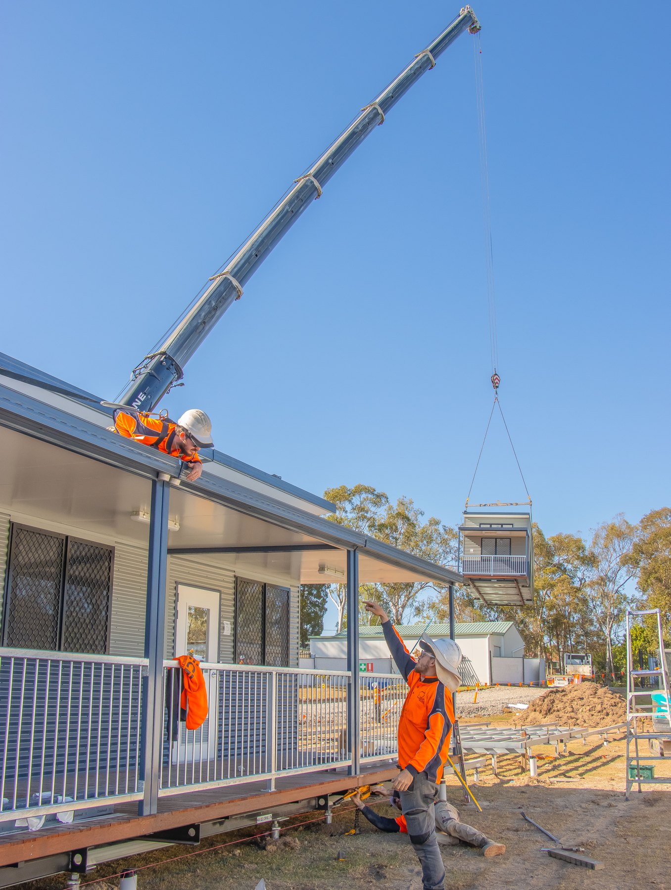 Modular building installation with a crane