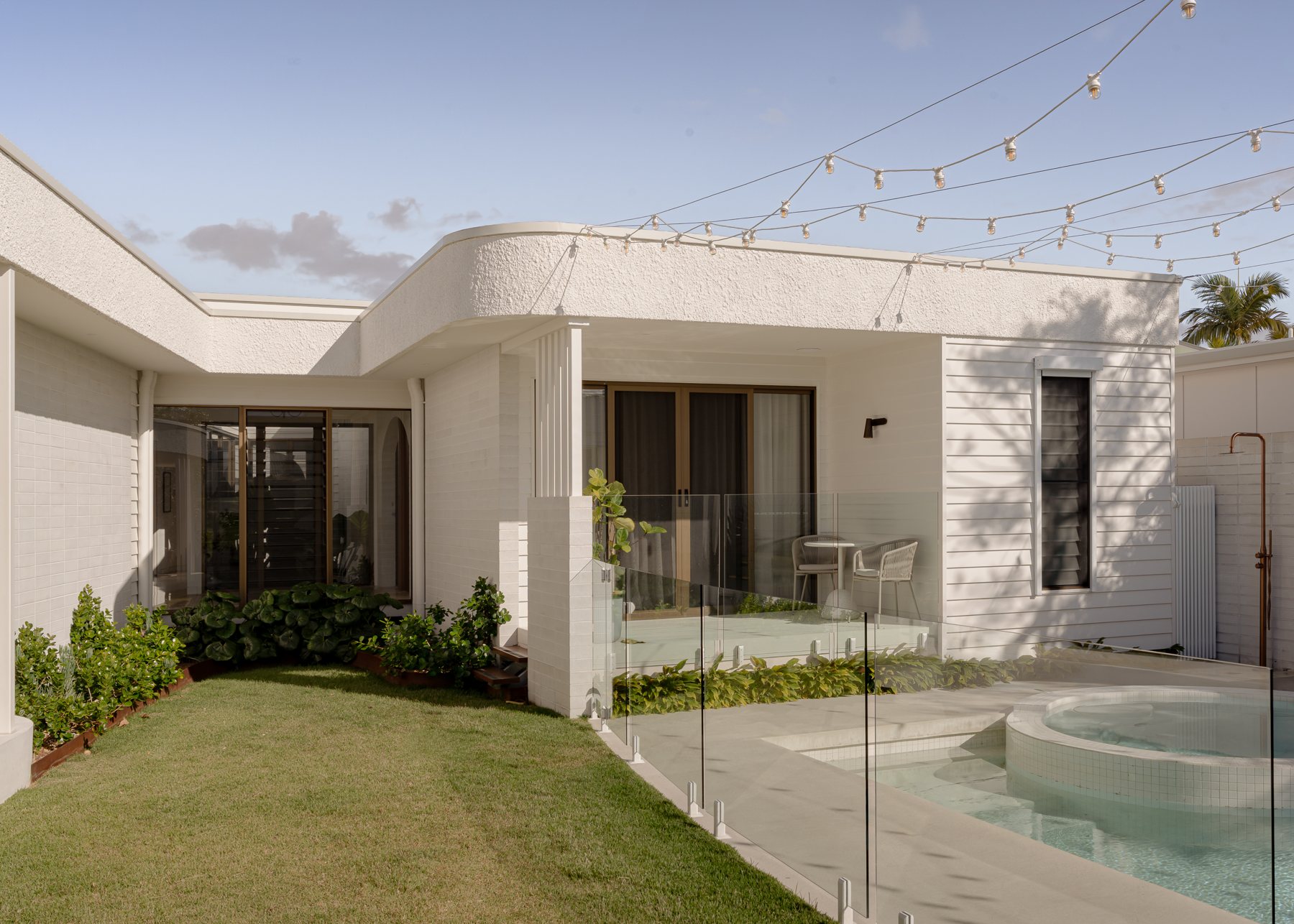 Completed House Sol home with a curved pool and courtyard